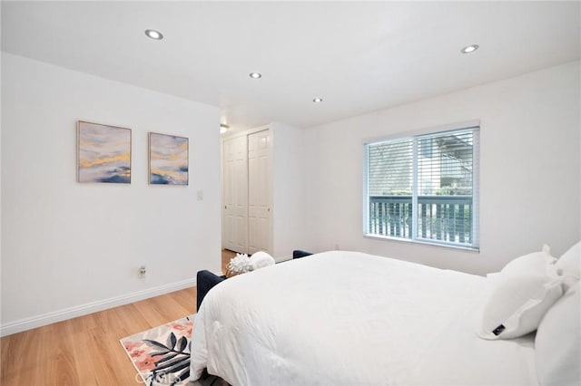 1117 Sepulveda Blvd Unit 2-102, Torrance, CA 90502 - bedroom with light wood-style floors, a closet, recessed lighting, and baseboards