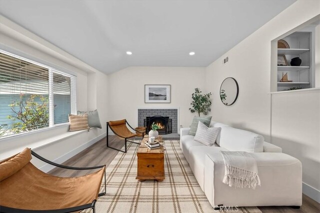 20512 Wayne Ave, Torrance, CA 90503 - living room featuring wood finished floors, baseboards, a brick fireplace, and recessed lighting