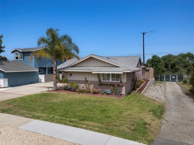 20512 Wayne Ave, Torrance, CA 90503 - single story home featuring concrete driveway, roof with shingles, and board and batten siding