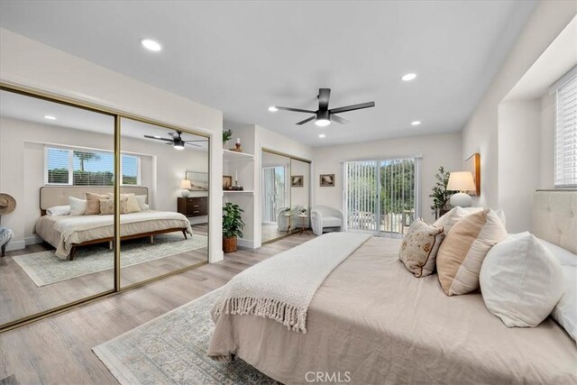 20512 Wayne Ave, Torrance, CA 90503 - bedroom featuring two closets, wood finished floors, multiple windows, and recessed lighting