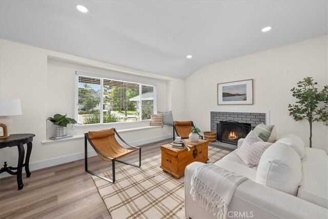 20512 Wayne Ave, Torrance, CA 90503 - living area with vaulted ceiling, light wood-style floors, recessed lighting, a fireplace, and baseboards