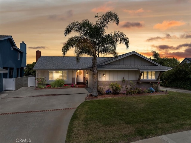 20512 Wayne Ave, Torrance, CA 90503 - view of front facade featuring driveway, board and batten siding, and a gate