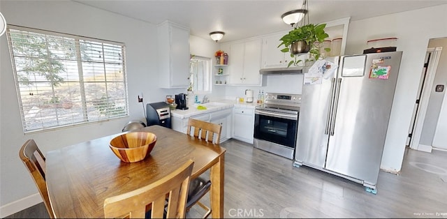 23201 Sprungle Cir, Menifee, CA 92587 - kitchen featuring stainless steel appliances, open shelves, white cabinets, light wood-type flooring, and light countertops