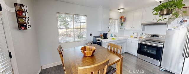 23201 Sprungle Cir, Menifee, CA 92587 - kitchen with freestanding refrigerator, electric stove, open shelves, and white cabinets