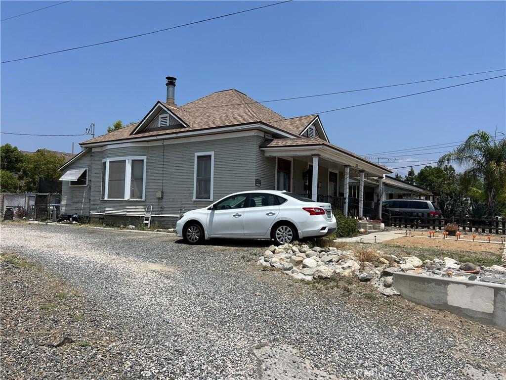 316 W Lugonia Ave, Redlands, CA 92374 - view of property exterior featuring roof with shingles