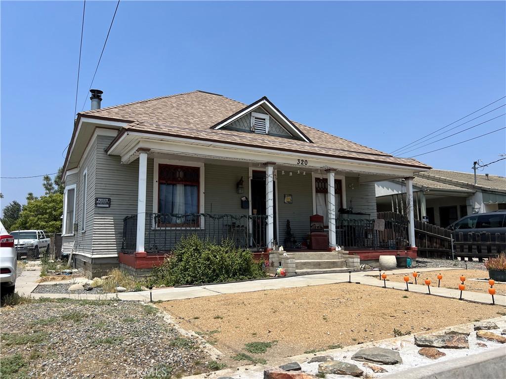 316 W Lugonia Ave, Redlands, CA 92374 - bungalow-style home featuring a porch and a shingled roof