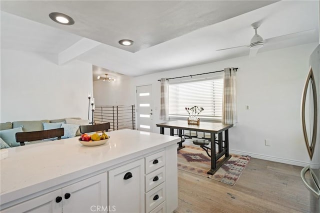 1637 Spreckels Ln, Redondo Beach, CA 90278 - kitchen with freestanding refrigerator, light wood-style floors, white cabinetry, light countertops, and recessed lighting