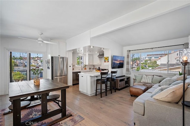 1637 Spreckels Ln, Redondo Beach, CA 90278 - living room featuring light wood-style floors, a ceiling fan, and plenty of natural light