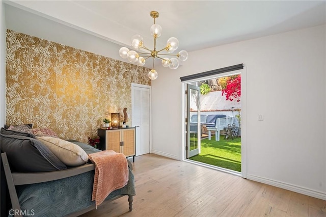 1637 Spreckels Ln, Redondo Beach, CA 90278 - bedroom featuring access to exterior, wood finished floors, a chandelier, and baseboards