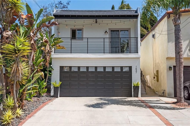 1637 Spreckels Ln, Redondo Beach, CA 90278 - view of front of home with a balcony, driveway, roof with shingles, an attached garage, and stucco siding