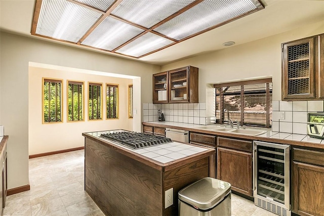 760 Kuffel Canyon Rd, Lake Arrowhead, CA 92385 - kitchen with wine cooler, tile countertops, appliances with stainless steel finishes, and tasteful backsplash