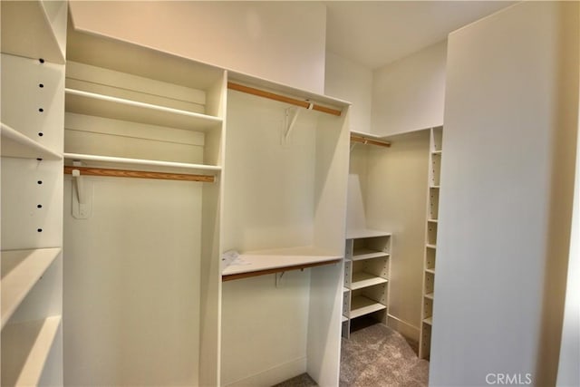 26603 Windward Rd, Lake Arrowhead, CA 92352 - walk in closet featuring carpet floors
