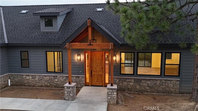 26603 Windward Rd, Lake Arrowhead, CA 92352 - view of front of house with stone siding and a shingled roof