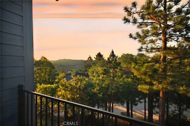 26603 Windward Rd, Lake Arrowhead, CA 92352 - balcony at dusk featuring a mountain view