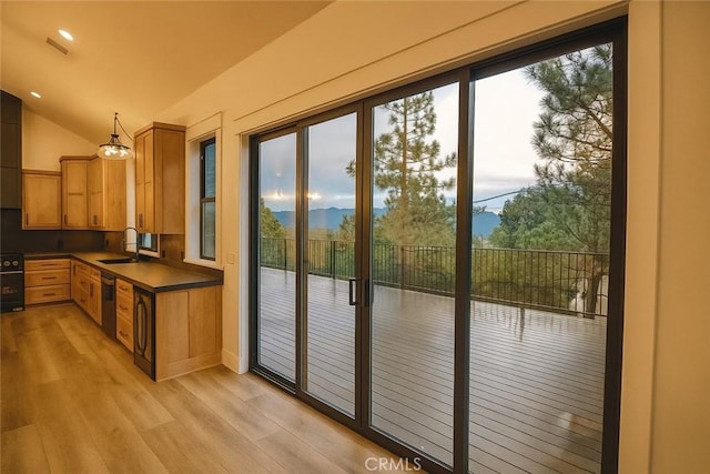 26603 Windward Rd, Lake Arrowhead, CA 92352 - entryway with light wood-style floors, vaulted ceiling, a mountain view, and recessed lighting