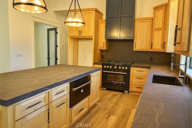26603 Windward Rd, Lake Arrowhead, CA 92352 - kitchen featuring high end stove, backsplash, light wood-style flooring, and decorative light fixtures