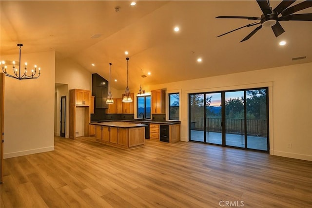 26603 Windward Rd, Lake Arrowhead, CA 92352 - kitchen with open floor plan, extractor fan, a chandelier, a kitchen island, and high vaulted ceiling