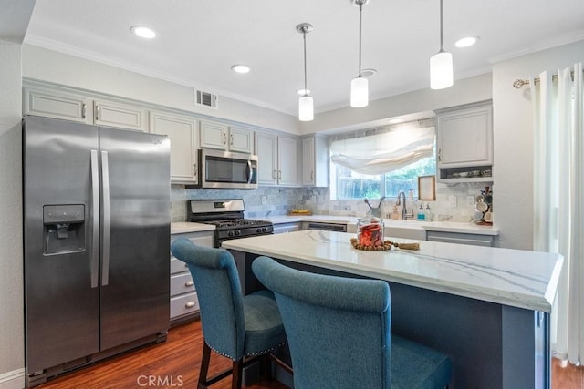 43500 Corte Barbaste, Temecula, CA 92592 - kitchen with appliances with stainless steel finishes, dark wood finished floors, decorative backsplash, a sink, and crown molding