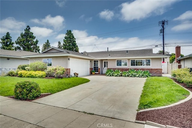 5272 Caliente Dr, Huntington Beach, CA 92649 - single story home with brick siding, a garage, a front lawn, driveway, and stucco siding