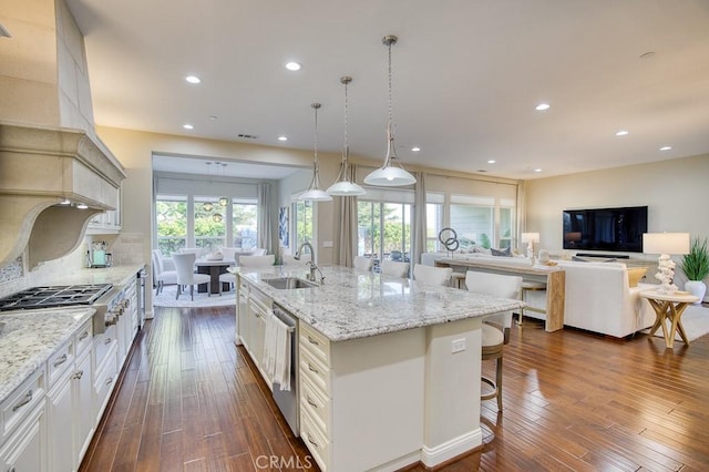 1801 Louise Ln, Nipomo, CA 93444 - kitchen featuring a sink, stainless steel appliances, a breakfast bar area, a large island, and light stone countertops