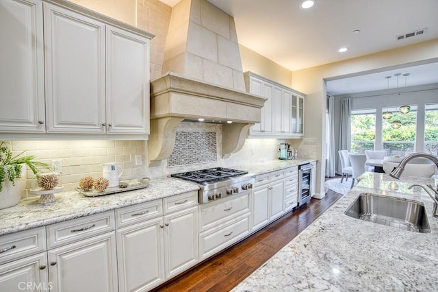 1801 Louise Ln, Nipomo, CA 93444 - kitchen with a sink, stainless steel gas cooktop, white cabinets, premium range hood, and recessed lighting