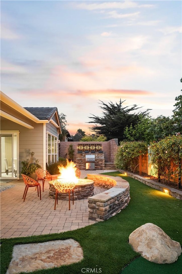 1801 Louise Ln, Nipomo, CA 93444 - yard at dusk with an outdoor fire pit, a patio, and area for grilling