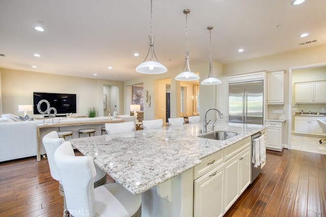 1801 Louise Ln, Nipomo, CA 93444 - kitchen with appliances with stainless steel finishes, a sink, a kitchen island with sink, open floor plan, and light stone countertops