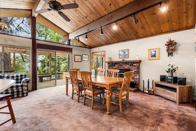 26823 Crestview Dr, Idyllwild, CA 92549 - dining room with carpet, rail lighting, ceiling fan, a fireplace, and wooden ceiling