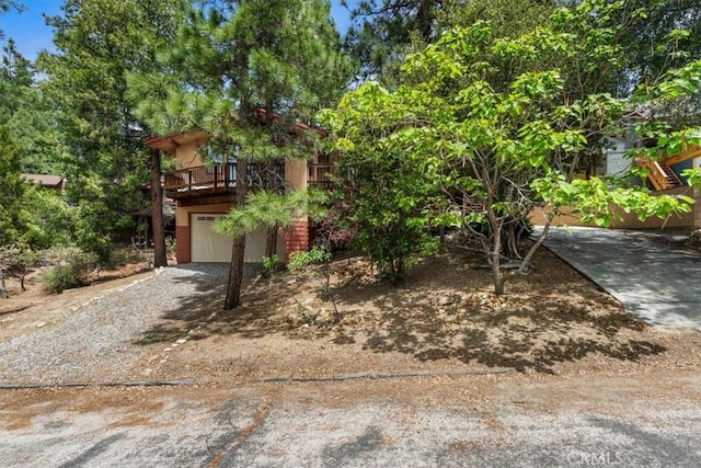 26823 Crestview Dr, Idyllwild, CA 92549 - view of property hidden behind natural elements with gravel driveway and an attached garage