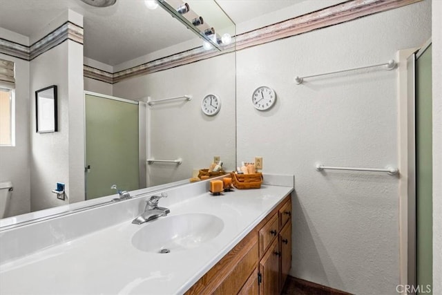 26823 Crestview Dr, Idyllwild, CA 92549 - full bathroom with toilet, a stall shower, vanity, and a textured wall