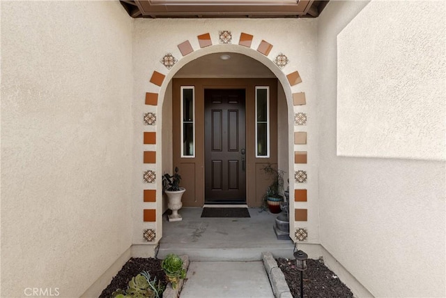 28341 Heather Green Way, Menifee, CA 92584 - doorway to property with stucco siding and an AC wall unit