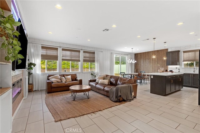 28341 Heather Green Way, Menifee, CA 92584 - living area with healthy amount of natural light, recessed lighting, wooden walls, and light tile patterned floors