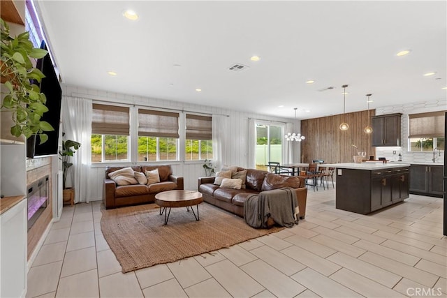 28341 Heather Green Way, Menifee, CA 92584 - living area featuring healthy amount of natural light, recessed lighting, and wooden walls