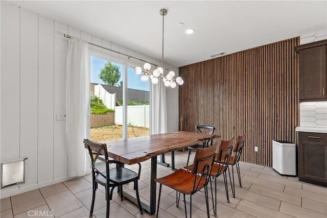 28341 Heather Green Way, Menifee, CA 92584 - dining room with a chandelier and wood walls