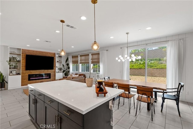 28341 Heather Green Way, Menifee, CA 92584 - kitchen featuring hanging light fixtures, a center island, recessed lighting, and light stone countertops