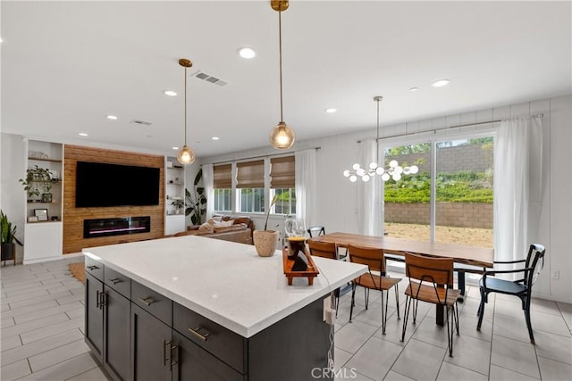 28341 Heather Green Way, Menifee, CA 92584 - kitchen with hanging light fixtures, a kitchen island, recessed lighting, and light stone countertops