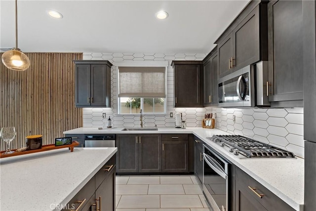 28341 Heather Green Way, Menifee, CA 92584 - kitchen featuring stainless steel appliances, light tile patterned floors, dark brown cabinetry, decorative backsplash, and recessed lighting