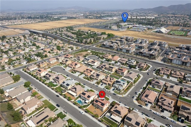 28341 Heather Green Way, Menifee, CA 92584 - aerial view of property and surrounding area featuring nearby suburban area and a mountainous background