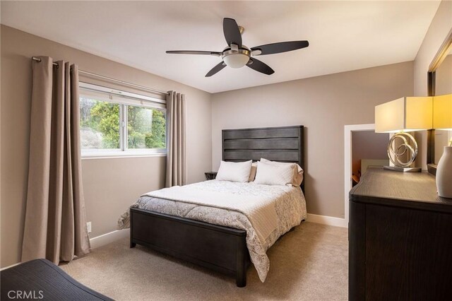 25611 Rangewood Rd, Laguna Hills, CA 92653 - bedroom with light carpet, baseboards, and a ceiling fan