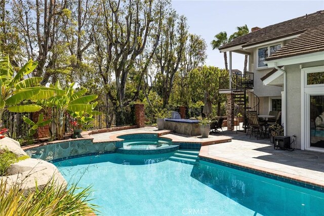 25611 Rangewood Rd, Laguna Hills, CA 92653 - view of pool featuring stairway, a patio, and a pool with connected hot tub