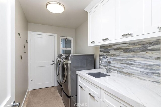 25611 Rangewood Rd, Laguna Hills, CA 92653 - washroom with washer and dryer, cabinet space, light carpet, and baseboards