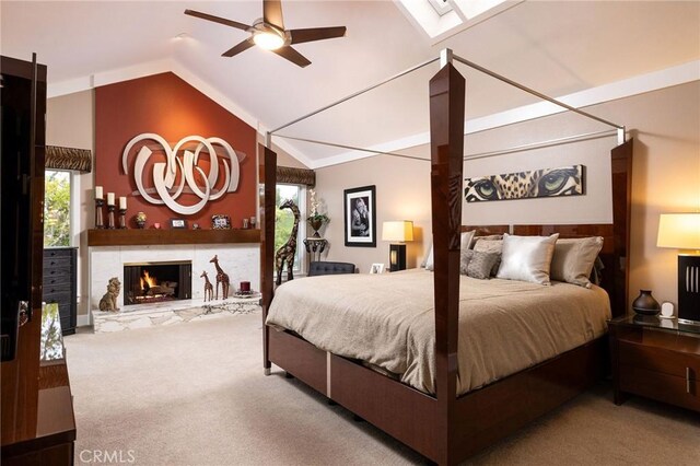 25611 Rangewood Rd, Laguna Hills, CA 92653 - carpeted bedroom featuring lofted ceiling, a warm lit fireplace, and ceiling fan
