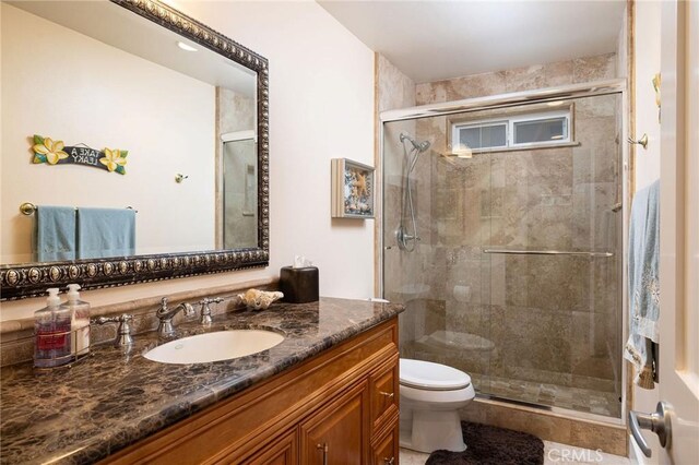 25611 Rangewood Rd, Laguna Hills, CA 92653 - full bathroom with toilet, vanity, a stall shower, and tile patterned flooring