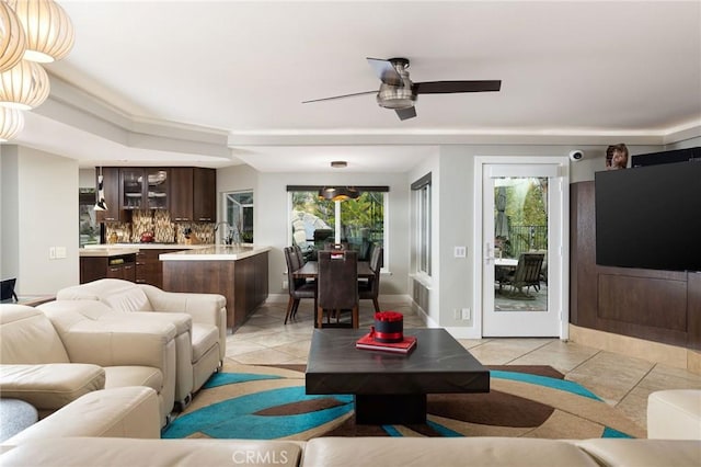 25611 Rangewood Rd, Laguna Hills, CA 92653 - living area featuring light tile patterned floors, plenty of natural light, and a ceiling fan
