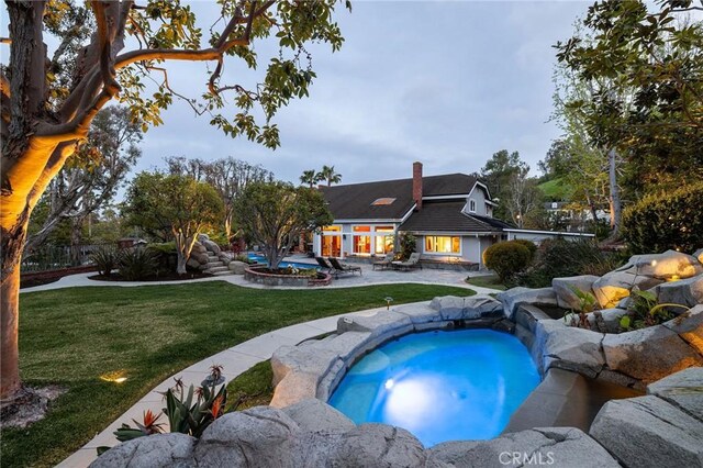25611 Rangewood Rd, Laguna Hills, CA 92653 - swimming pool featuring a lawn, a patio, and an outdoor hangout area