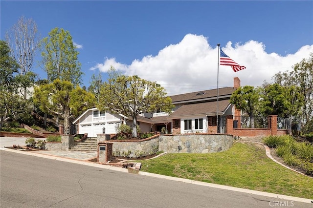 25611 Rangewood Rd, Laguna Hills, CA 92653 - view of front facade with a front lawn and brick siding