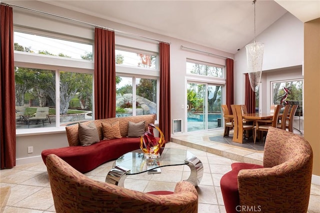 25611 Rangewood Rd, Laguna Hills, CA 92653 - living room featuring high vaulted ceiling, baseboards, and tile patterned floors