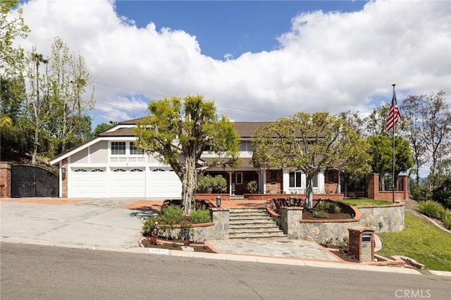 25611 Rangewood Rd, Laguna Hills, CA 92653 - obstructed view of property featuring driveway and brick siding