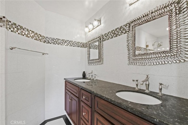 4205 Hermitage Dr, Hacienda Heights, CA 91745 - bathroom featuring tile walls, double vanity, and tasteful backsplash