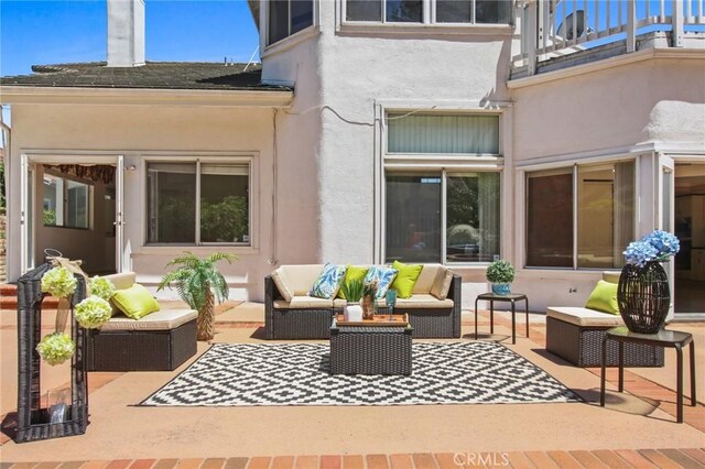 4205 Hermitage Dr, Hacienda Heights, CA 91745 - rear view of property with a balcony, stucco siding, an outdoor hangout area, and a patio